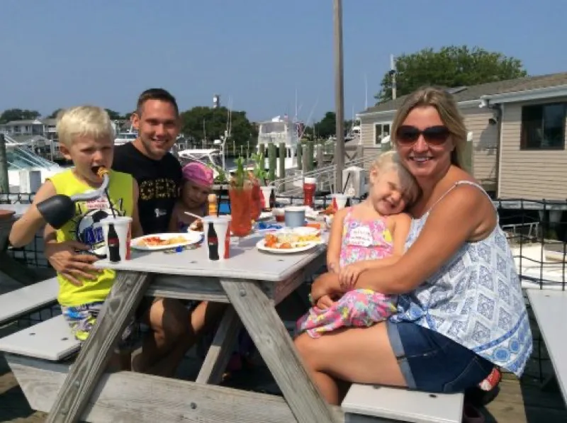 Guests dining on the outdoor deck